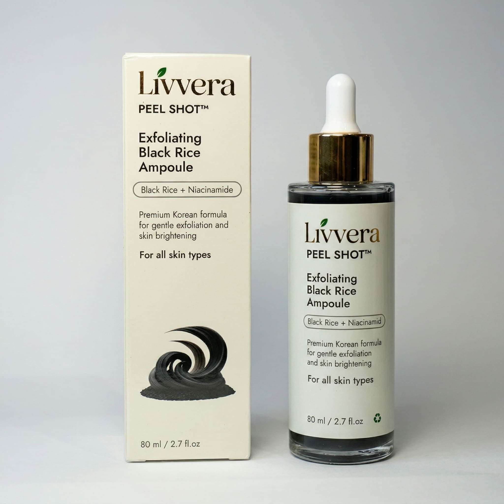 Livvera Exfoliating Black Rice Ampoule bottle and packaging on a gray background